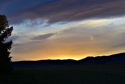 Scenic view of silhouette landscape against sky during sunset