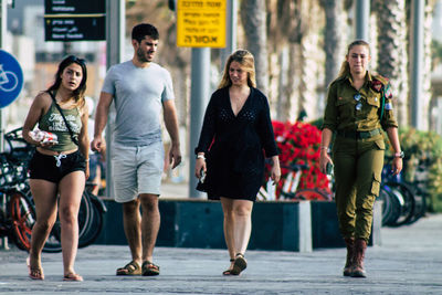 Group of people walking in city