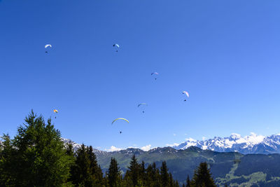 Scenic view of mountains against clear blue sky