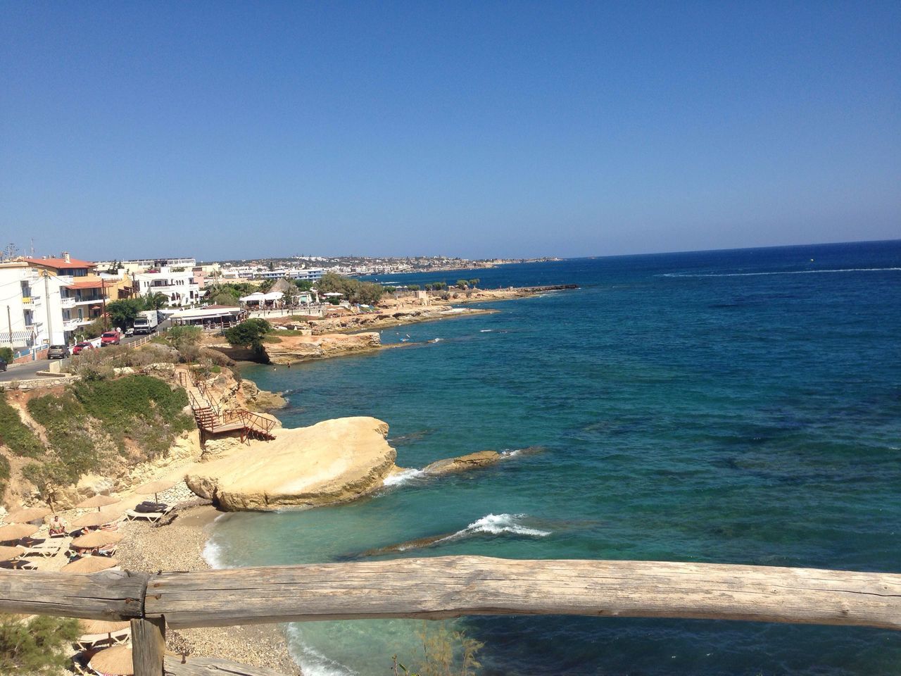 clear sky, water, built structure, sea, architecture, blue, horizon over water, rock - object, nature, scenics, day, sky, tranquil scene, outdoors, tranquility, beauty in nature, town, no people, coastline, residential district, idyllic, travel destinations, sunny, ocean