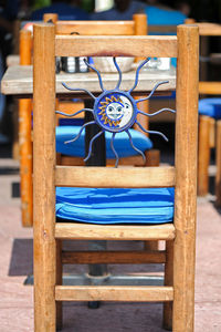 Close-up of chairs on table at restaurant