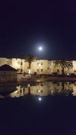 Buildings in city at night