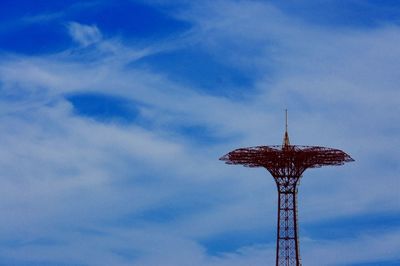 Low angle view of communications tower against sky