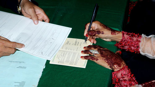 High angle view of people on paper at home