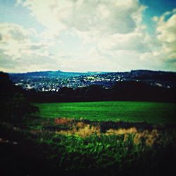 Scenic view of landscape against cloudy sky