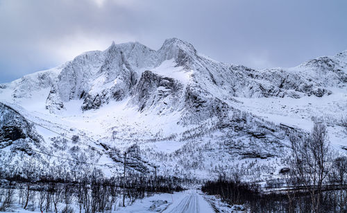 Snow covered mountain against sky