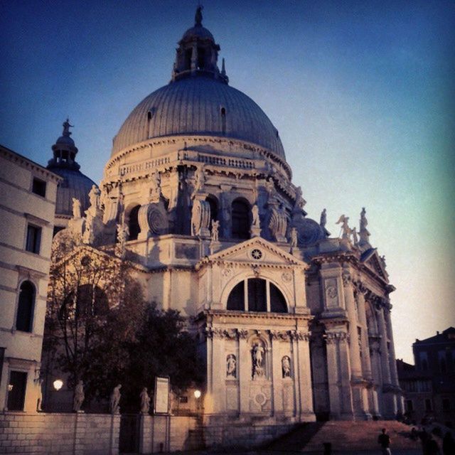 place of worship, religion, church, building exterior, architecture, spirituality, built structure, cathedral, dome, clear sky, cross, low angle view, facade, travel destinations, blue, famous place, history, travel