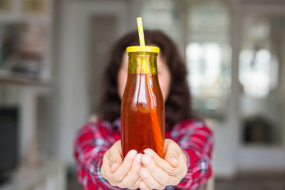 Close-up of hand holding drink