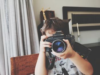 Portrait of woman photographing