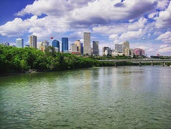 City skyline against cloudy sky