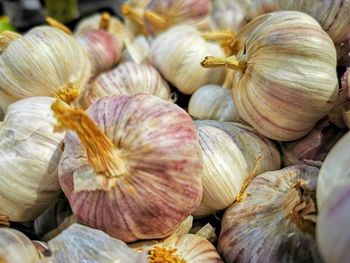 Full frame shot of garlics for sale at market stall