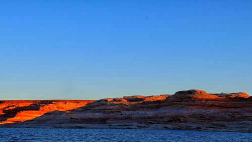 Scenic view of landscape against clear blue sky