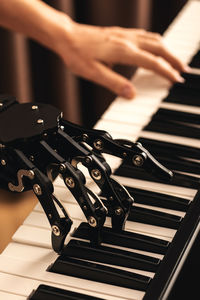 Human with neural hand prosthesis playing piano