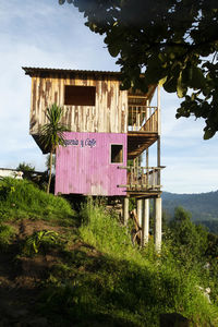 House on field against sky