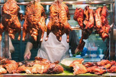 People for sale at market stall