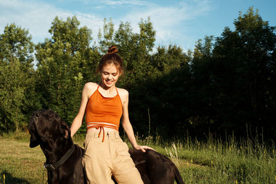 Young man riding horse on a field