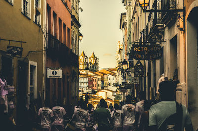 People walking on street in city