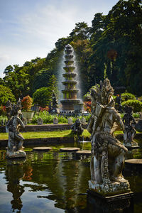 Fountain in temple against sky