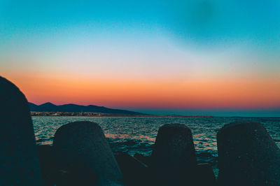 Scenic view of sea against clear sky during sunset