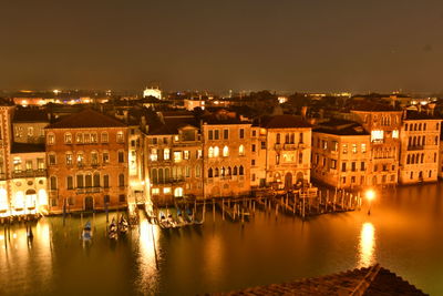 Illuminated buildings in city at night