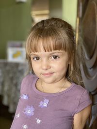Portrait of cute smiling girl at home
