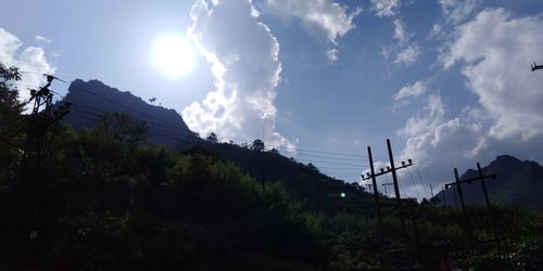 Low angle view of electricity pylon against sky