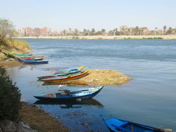 High angle view of river by city against clear sky