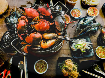 Fresh seafood grilled over charcoal grilled with crabs, shrimp, clams