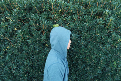 Low section of man standing on plant