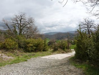 Scenic view of mountains against cloudy sky