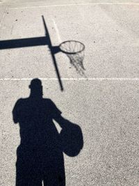 Shadow of people on road