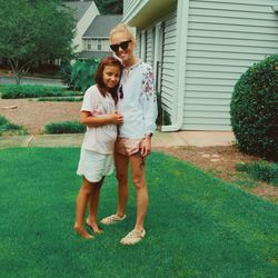 Full length of women standing on grass