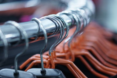 Close-up of coathangers on rack