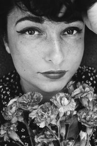 Close-up portrait of woman with flowers