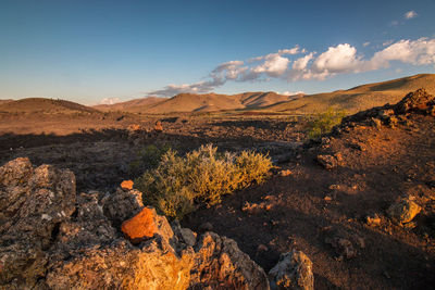 Scenic view of landscape and mountains against sky
