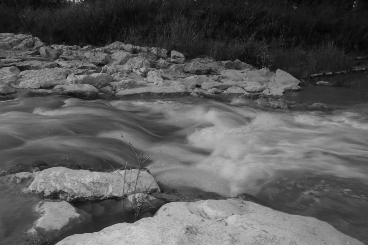 water, rock - object, nature, beauty in nature, scenics, tranquility, river, stream, tranquil scene, rock formation, flowing water, rock, motion, flowing, high angle view, lake, idyllic, non-urban scene, outdoors, day