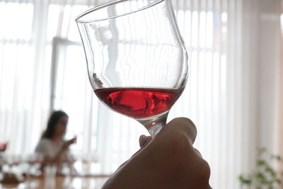 Close-up of man drinking glass