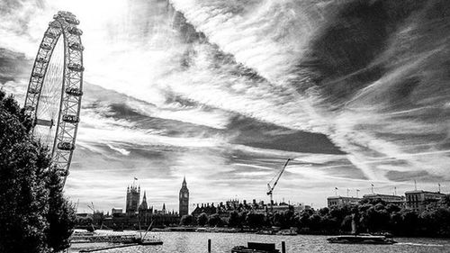 Buildings against cloudy sky