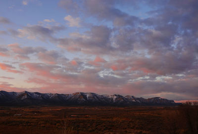 Scenic view of landscape against sky during sunset