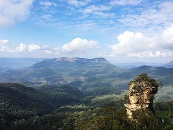 Scenic view of mountain against cloudy sky