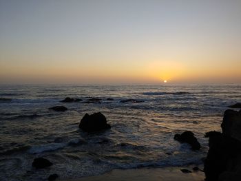 Scenic view of sea against sky during sunset