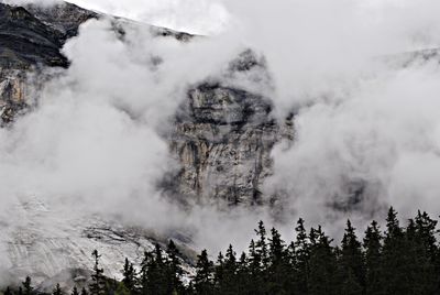 Scenic view of clouds over mountain