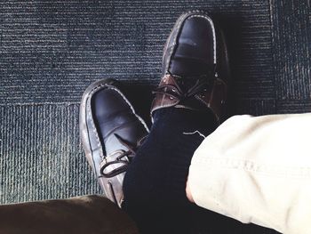 Low section of man standing on floor