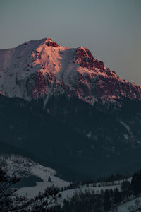 Bucegi mountains seen from the city of bran, romania. beautiful winter landscape. 