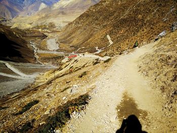 Shadow of people on mountain road