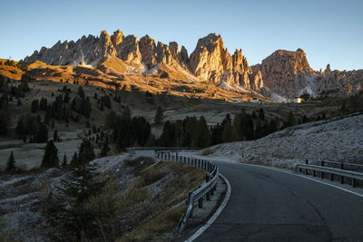 Panoramic view of road and mountains against clear sky