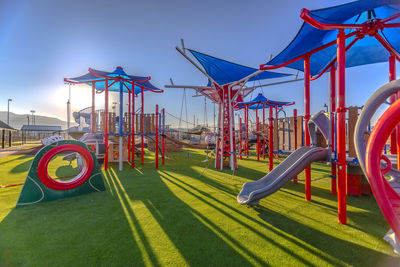 View of playground at park against sky