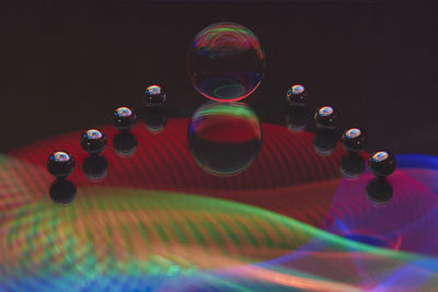 Close-up of bubbles over black background