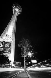 Low angle view of illuminated street at night