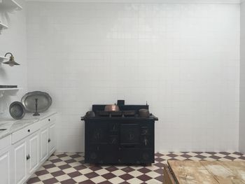 Stove against wall in kitchen at home